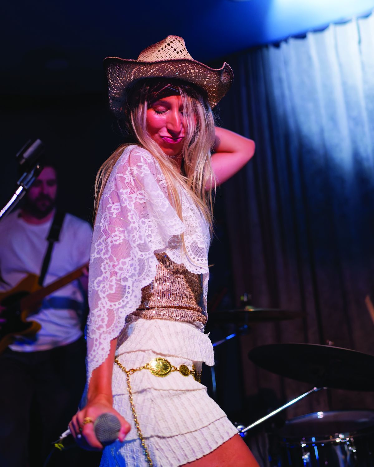 Sylvie in a cowboy hat on stage